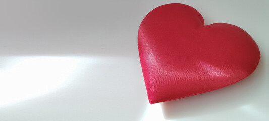 Celebrating love with a red heart symbol minimalist setting photography soft light abstract concept