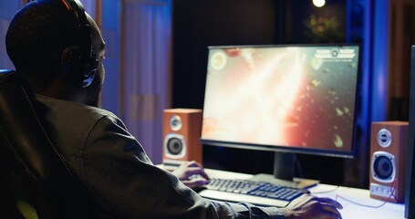 Gamer losing intense singleplayer spaceship arcade racing videogame, seeing game over screen on...