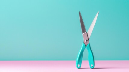 Teal scissors on pink and mint backdrop