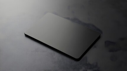 A Black Card Lies on a Dark Textured Surface