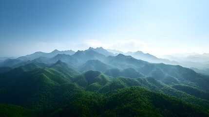 Obraz premium Aerial View of Lush Green Mountains Under a Blue Sky
