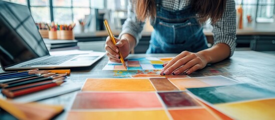 Creative Graphic Designers Collaborating on Color Selection in Modern Office Workspace