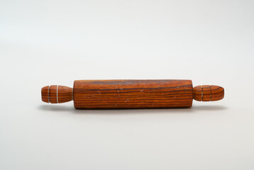 Medium wooden rolling pin on white background.