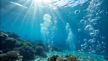 Fototapeta premium Underwater action shot of bubbles surging towards the surface, backlit by strong sun rays. A high-energy and dramatic aquatic image