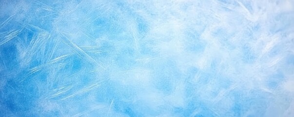 Obraz premium A soft, frosty background featuring shades of blue and white, evoking a cool, wintry atmosphere.
