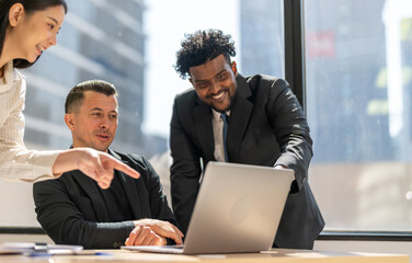 Diverse team brainstorming business meeting, professional presentation with data charts, team...