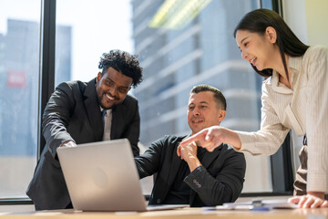 Diverse team brainstorming business meeting, professional presentation with data charts, team collaboration for project planning, modern corporate office teamwork, group discussing business strategies