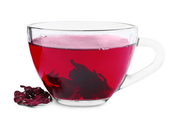 Delicious hibiscus tea in glass cup and dry roselle sepals isolated on white