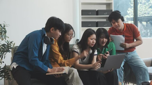Five young Asian students engage in online study on campus, collaborating on research, projects. They help each other with assignments, gaining valuable experience and preparing for future careers.