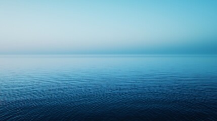 Obraz premium A smooth blue gradient background that gently shifts from light to deep blue, perfect for creating a calming and balanced atmosphere.
