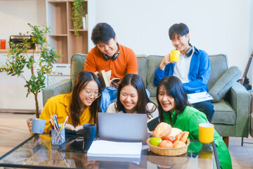 Five young Asian students engage in online study on campus, collaborating on research, projects. They help each other with assignments, gaining valuable experience and preparing for future careers.