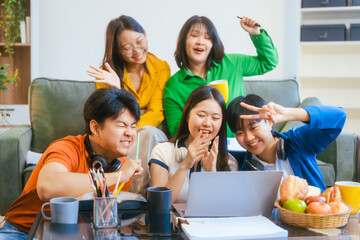 Five young Asian students engage in online study on campus, collaborating on research, projects. They help each other with assignments, gaining valuable experience and preparing for future careers.