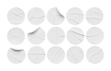 collection of white mockup round crumpled stickers, white paper, adhesive or labels, wrinkled plastic stickers, blank template of labels or price tags. clipping path.