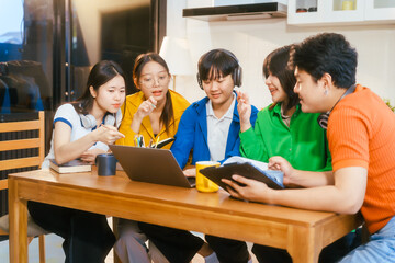 Five young Asian students engage in online study on campus, collaborating on research, projects. They help each other with assignments, gaining valuable experience and preparing for future careers.