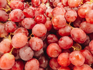 Close up of raw organic sweet red grapes background, wine grapes texture, Healthy fruits Red wine grapes background, top view