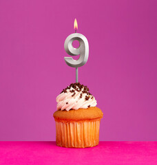 Birthday card on violet background - Candle number 9