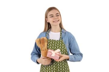 PNG, March 8. Girl in an apron with a wooden set of kitchen utensils, isolated on a white background.