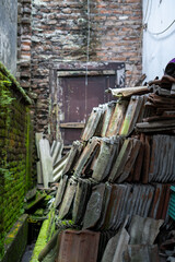 Pile of unused tiles in the corner of the house