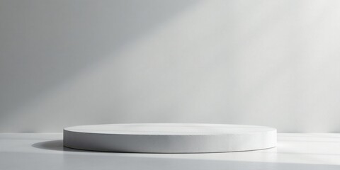 Fototapeta premium Empty White Circular Pedestal Display in Soft Light Setting for Product Presentation