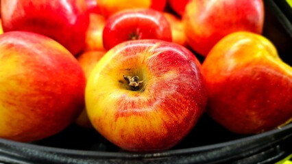 Fresh and ripe red apples sold  at supermarket.
