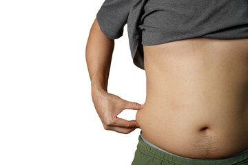 Closeup man measuring stomach fat with her hands isolated and white background with clipping path