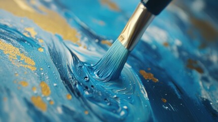 Fototapeta premium Abstract Blue and Gold Painting: A Close-Up of a Brush Applying Paint