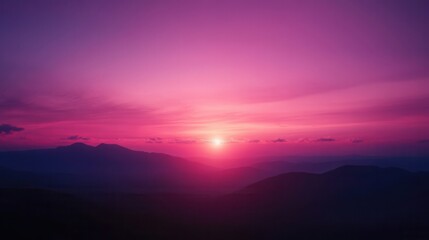 Obraz premium Majestic Mountain Sunrise Pink and Purple Sky Over Silhouette Peaks