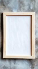 Fototapeta premium Blank Wooden Picture Frame Mockup on Concrete Wall Showcase Your Art, Photography, or Designs with This Minimalist Frame Perfect for Presentations, Portfolio Displays, or Social Media Content