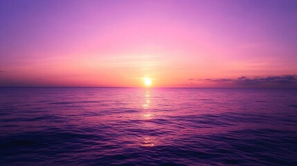 Fototapeta premium Vivid Pink and Purple Ocean Sunset with Reflected Sunlight
