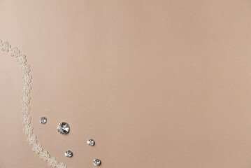 Sewing accessories on beige background. Flat lay, top view. Copy space