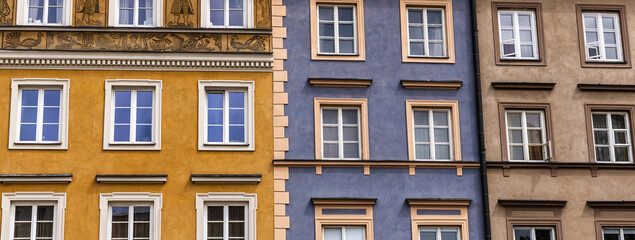 The colorful facades of the tenement buildings in the Stare Miasto, (Old Town,) Warsaw, Poland.