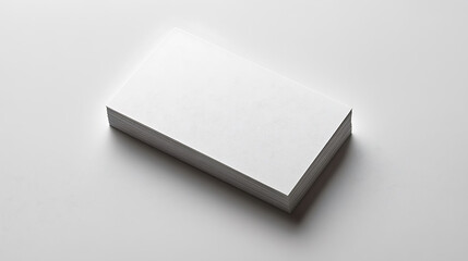 Fototapeta premium Top view blank white business card isolated on white background. Minimalist mockup for branding, design presentation, and corporate identity.