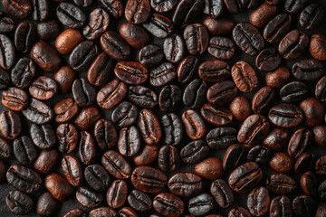 Coffee beans on the rustic background. Shot from above. Background and textures.