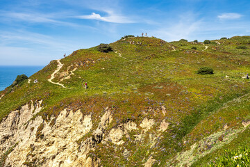 Hiking on the rocky cliffs of Cabo da Roca at the Atlantic coast of Portugal, Europe