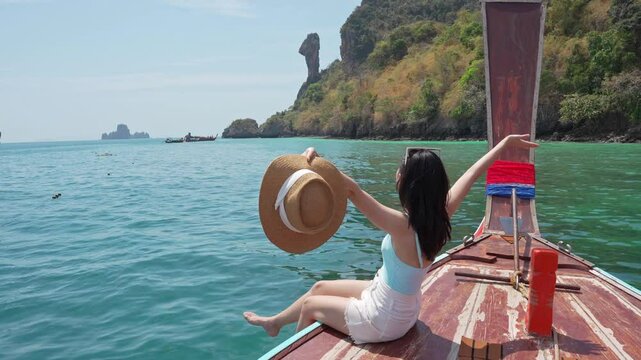 Young Asian woman relaxing and enjoying at Chicken island in Krabi Thailand, Travel on summer vacation