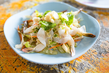 Thai Traditional cuisine features fresh, uncooked shrimp and a spicy and herb infused sauce. Shrimp in fish sauce Thai style