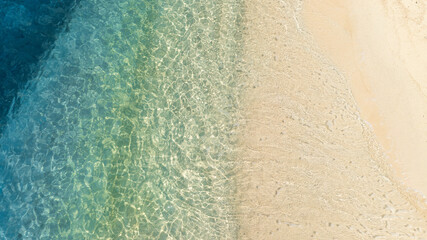 nature of the beach and sea Summer with sunshine, sandy beaches, clear blue waters sparkling against the blue sky. On an island with good ecology and environment Background for summer vacation