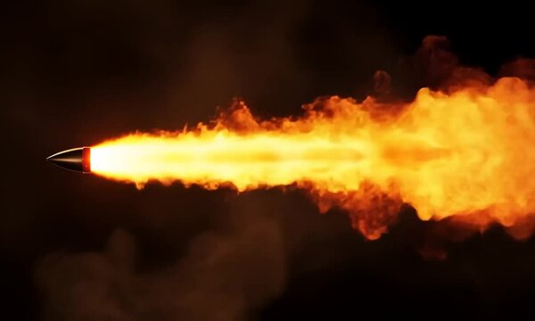 Flaming bullet in dark smoky background