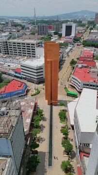 Aerial video of downtown Guadalajara, reversing from the iconic El Palomar monument designed by Luis Barragan, showcasing the urban landscape