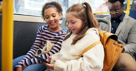 Children, students and travel on bus with phone for watching videos, online cartoon and educational game. Happy friends, girls and trip on public transport for morning commute and school destination © peopleimages.com