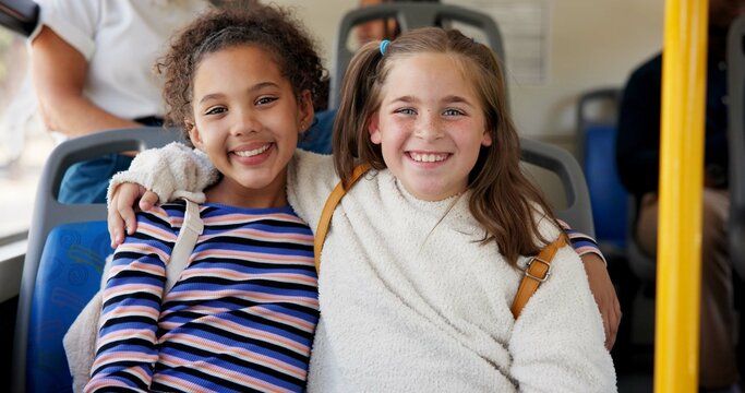 Friends, children and happy with bus travel for school destination, morning commute or bonding together. Girls portrait, smile or backpack on public transportation for ride service or student journey