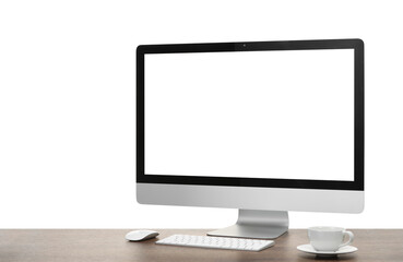 Fototapeta premium Computer monitor, keyboard, mouse and cup of drink on wooden desk against white background