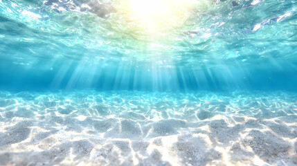 Underwater sunbeams illuminate ocean floor sand