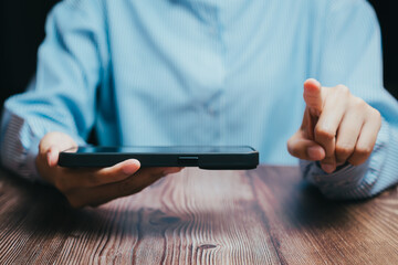 Person Using Tablet Device with Focus on Hand and Touch Gesture, Business concept