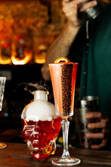 Craft Cocktail Pouring: Skull Bottle and Vintage Glass