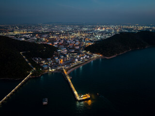 Obraz premium Night Scene Factory Oil and Gas Refinery. Fuel Energy Plant. Industrial Site. Industries about energy consumption on island,