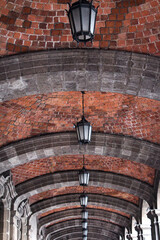 Long Brick Arched Corridor with Lanterns