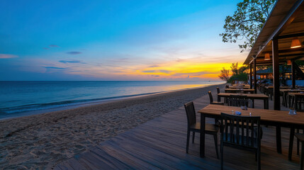 Elegant Beachfront Restaurant Featuring Wooden Tables at Sunset by the Sea