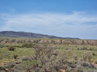 beautiful landscape with mountains and desert in the background

