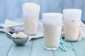 Three refreshing bubbly Boston Coolers. Vanilla ice cream with ginger ale soda pop floats. Selective focus with blurred background.